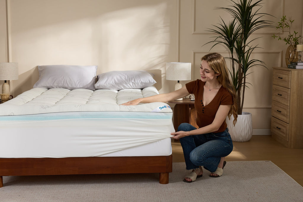 White bamboo cooling mattress topper on a bed