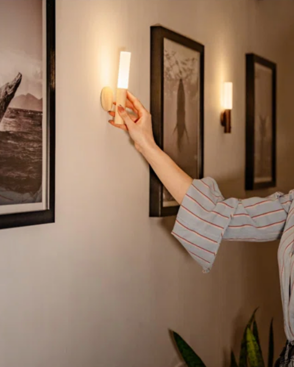 Wren battery powered wall sconce in a bedroom setting