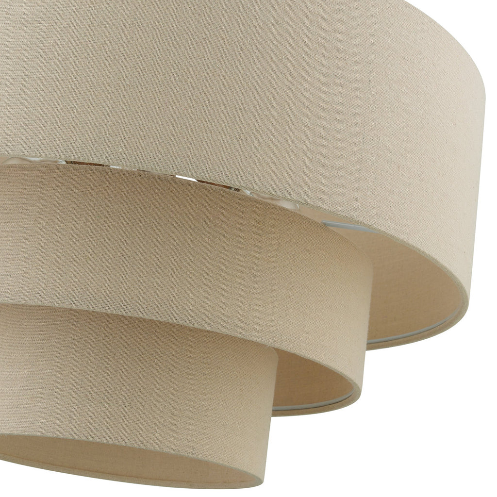 Tiered drum chandelier with stacked beige fabric shades and gold canopy for dining room or entryway