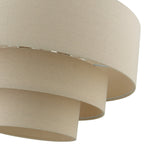Tiered drum chandelier with stacked beige fabric shades and gold canopy for dining room or entryway
