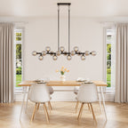 Black linear sputnik chandelier with staggered smoky glass globes, dimmable with G9 LED bulbs